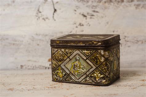 antique metal box with hinged lid